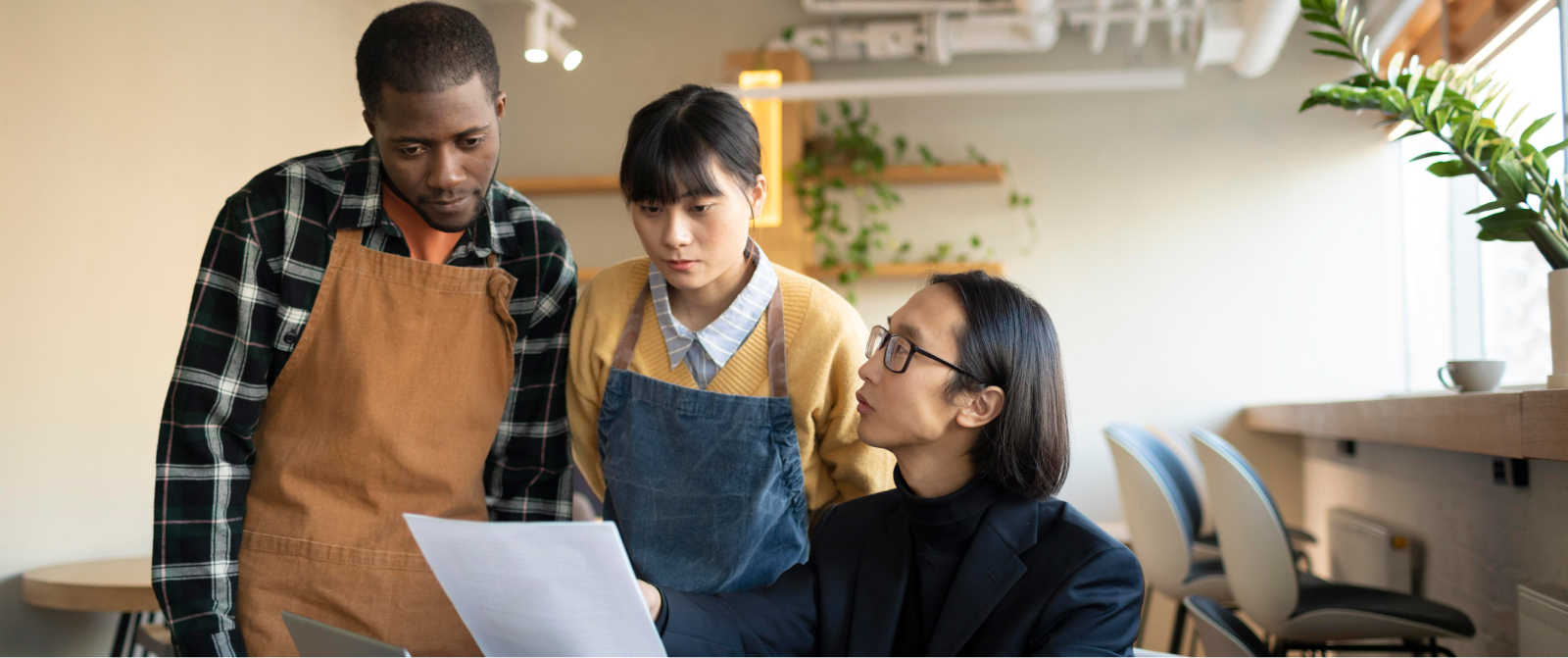 A leader reviews hiring strategies with team members, focusing on alignment and systems for sustainable business growth.