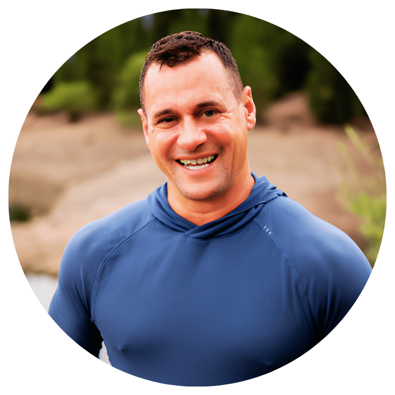 A professional leader wearing a blue athletic shirt, embodying a mindset for sustainable growth and intentional alignment.