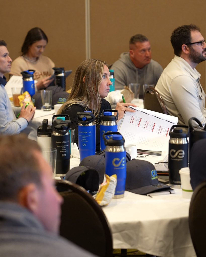 Professionals engaging in a strategy workshop, focused on leadership alignment and systems for sustainable growth.