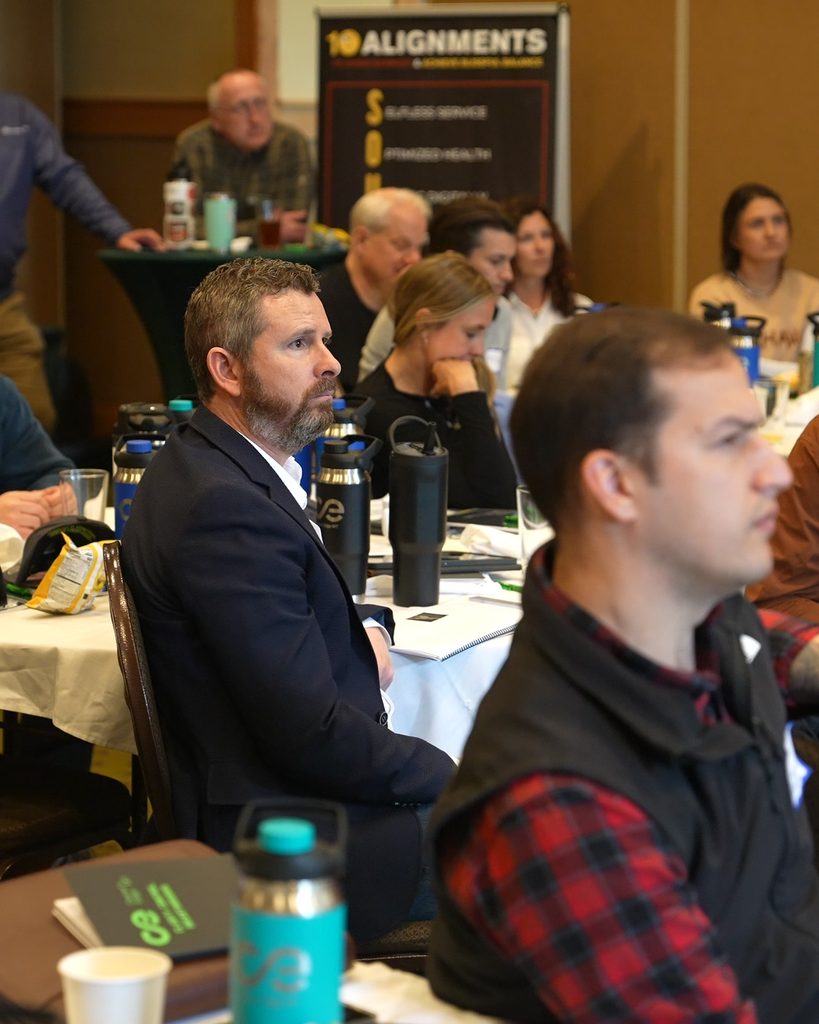 Business professionals engage in a leadership workshop focused on strategic alignment and sustainable growth.